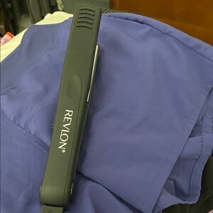 Revlon black  smaller size flat iron tool. Used once.